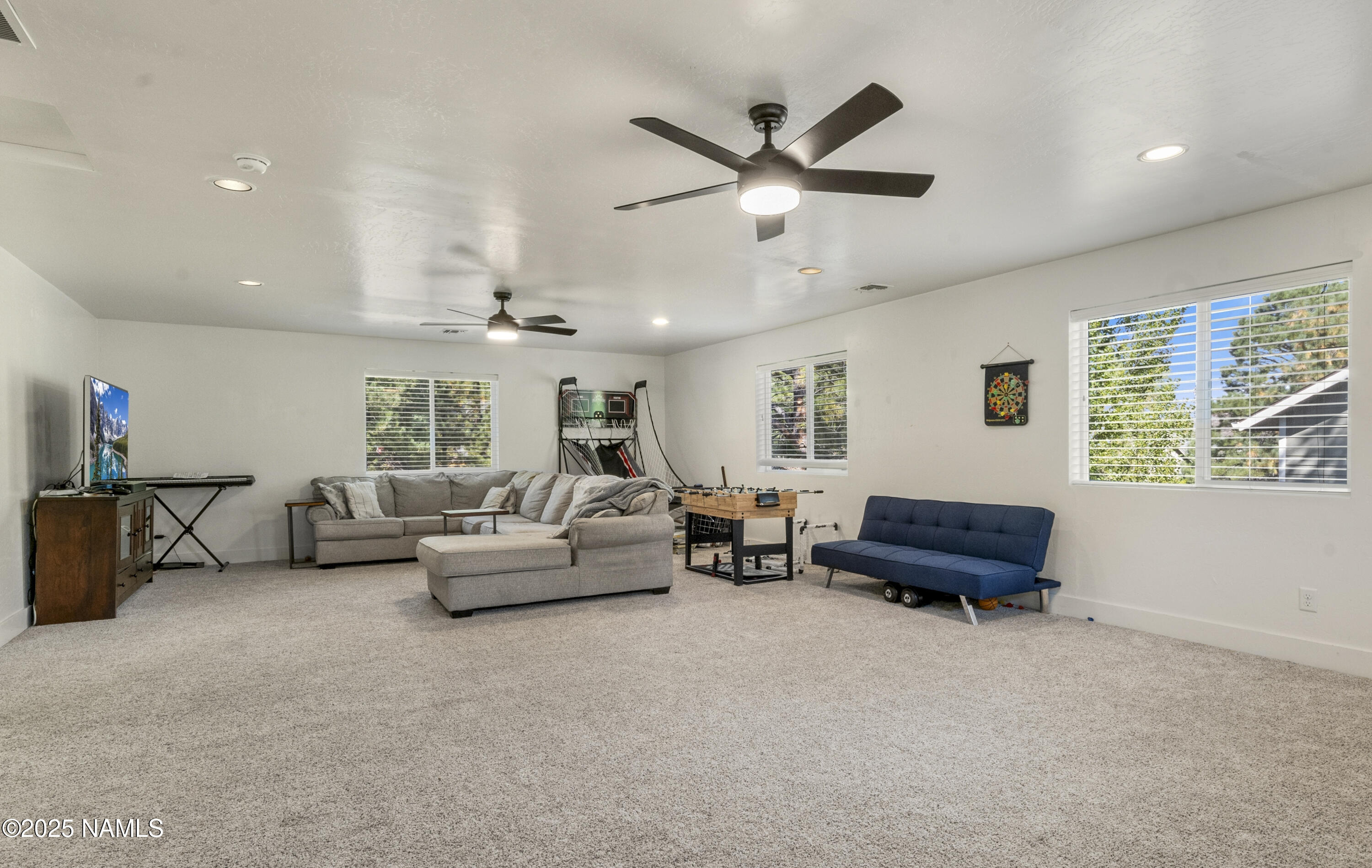 5053 South Topaz Road Flagstaff, AZ 86005 - Photo 12 of 25 a living room with furniture and a window