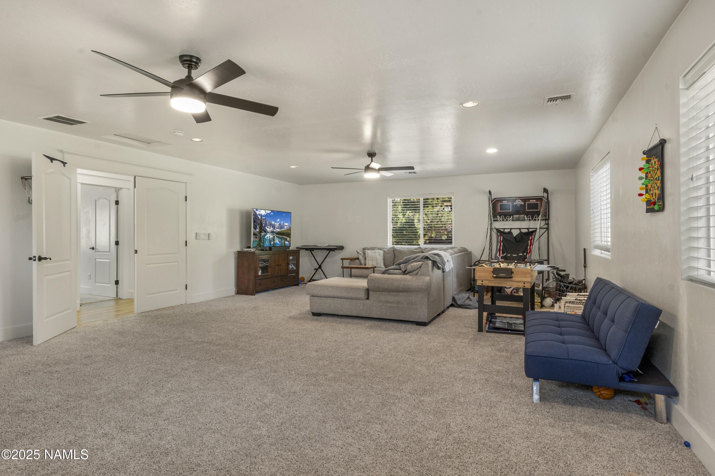 5053 South Topaz Road Flagstaff, AZ 86005 - Photo 13 of 25 a living room with furniture and a ceiling fan