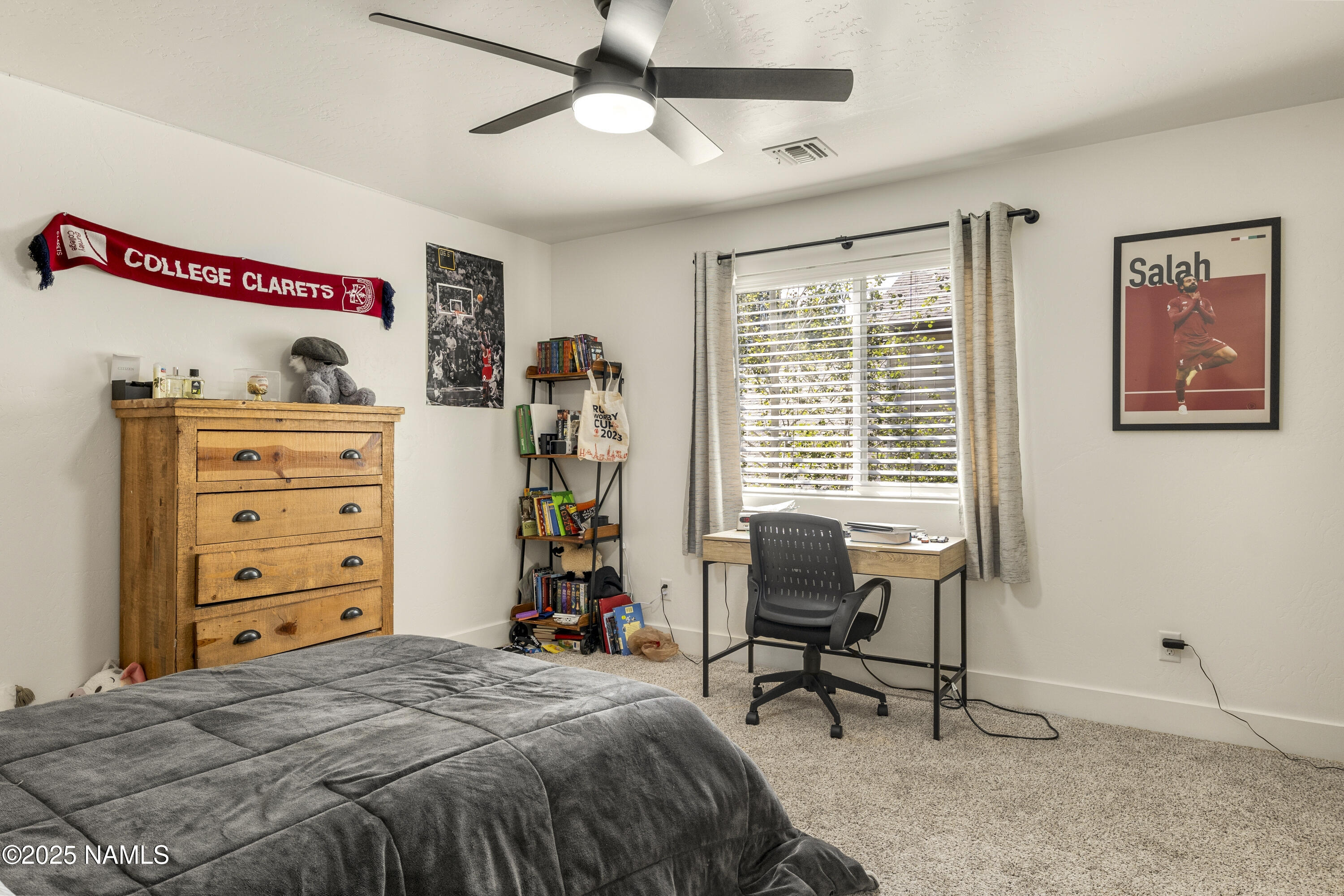5053 South Topaz Road Flagstaff, AZ 86005 - Photo 14 of 25 a bedroom with a bed and a window