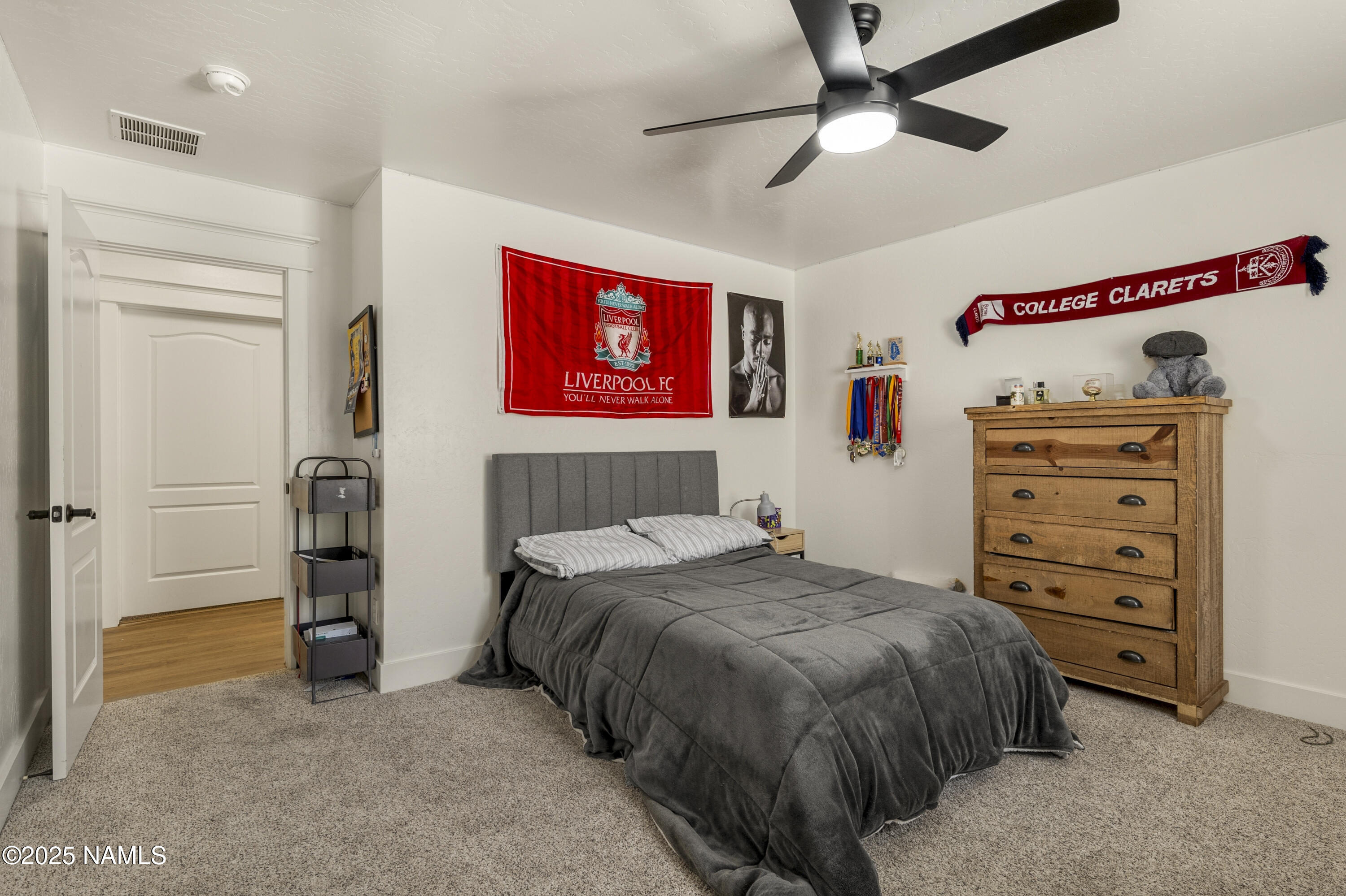 5053 South Topaz Road Flagstaff, AZ 86005 - Photo 15 of 25 a bedroom with a bed and a walk in closet