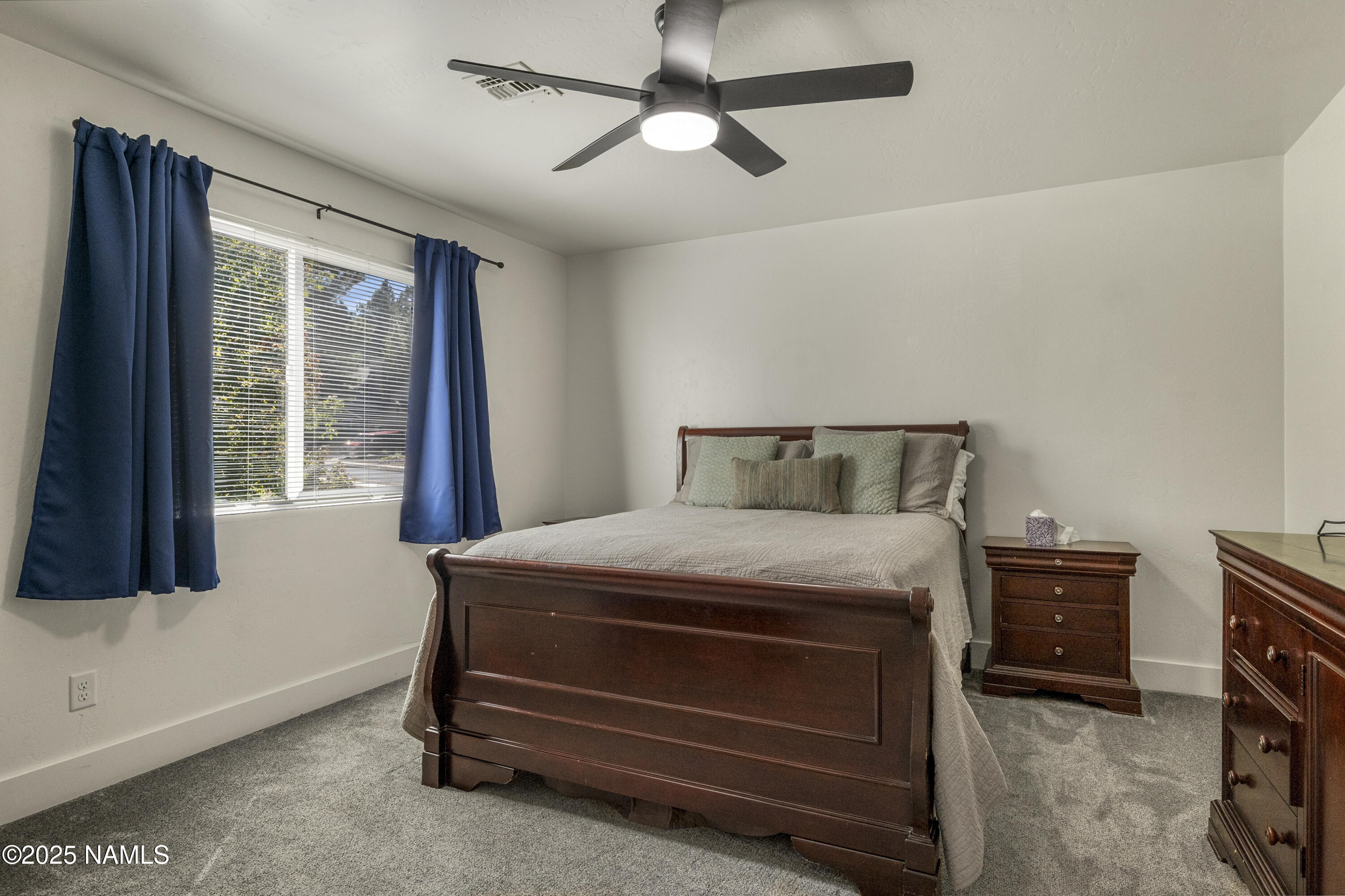 5053 South Topaz Road Flagstaff, AZ 86005 - Photo 17 of 25 a bedroom with a bed and a window