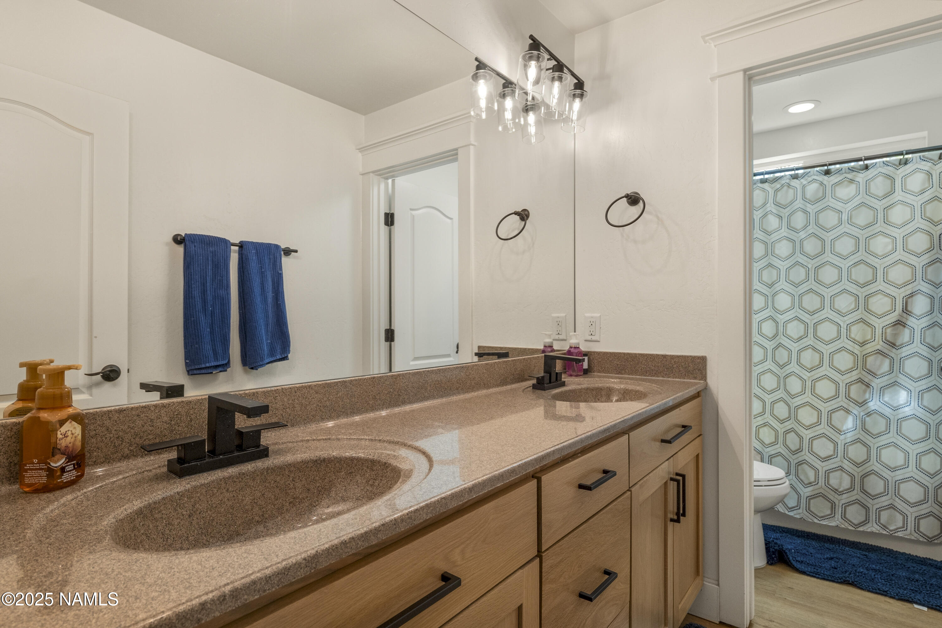 5053 South Topaz Road Flagstaff, AZ 86005 - Photo 19 of 25 a bathroom with a sink and a mirror