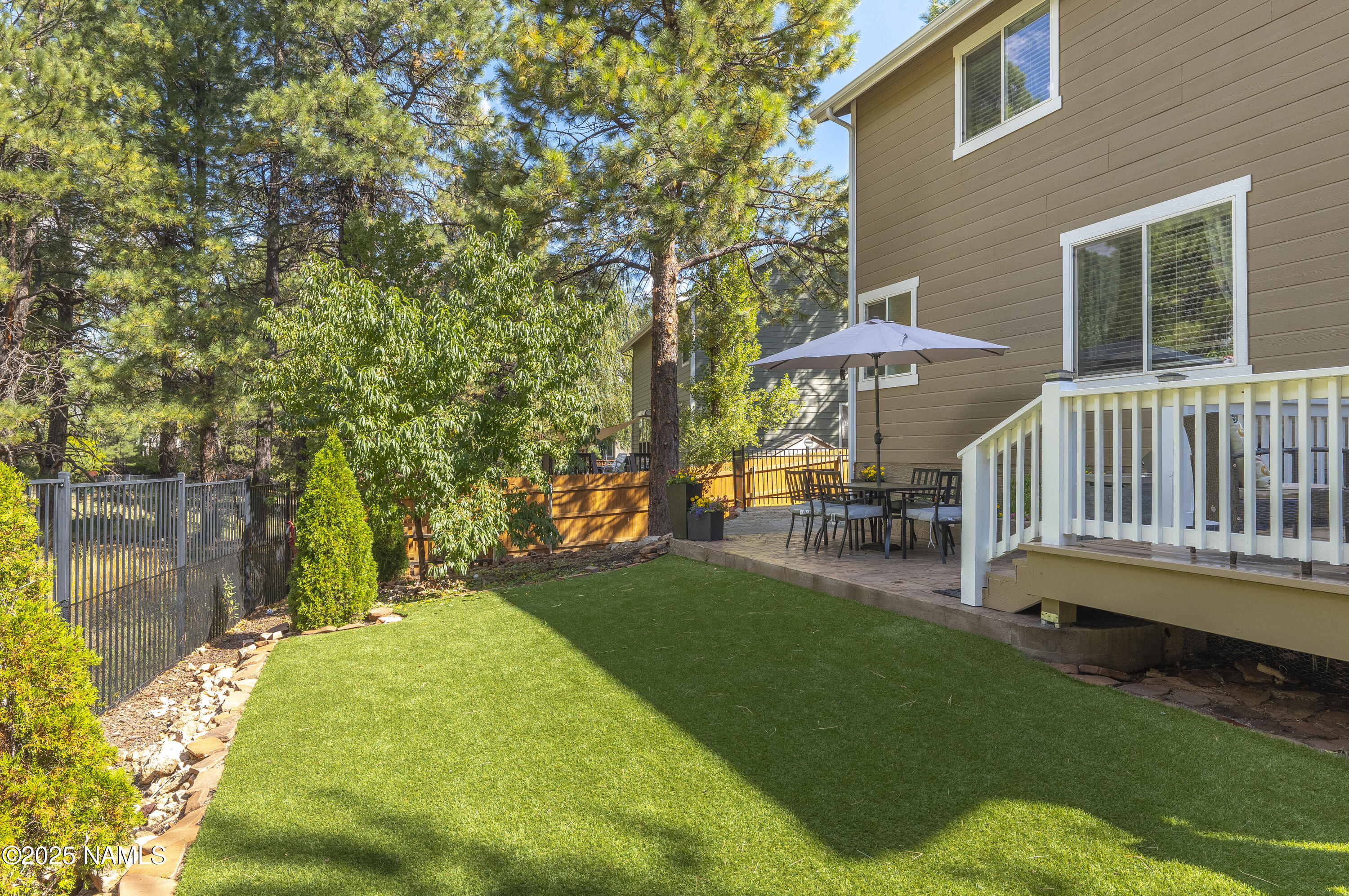 5053 South Topaz Road Flagstaff, AZ 86005 - Photo 24 of 25 a view of a house with backyard and sitting area