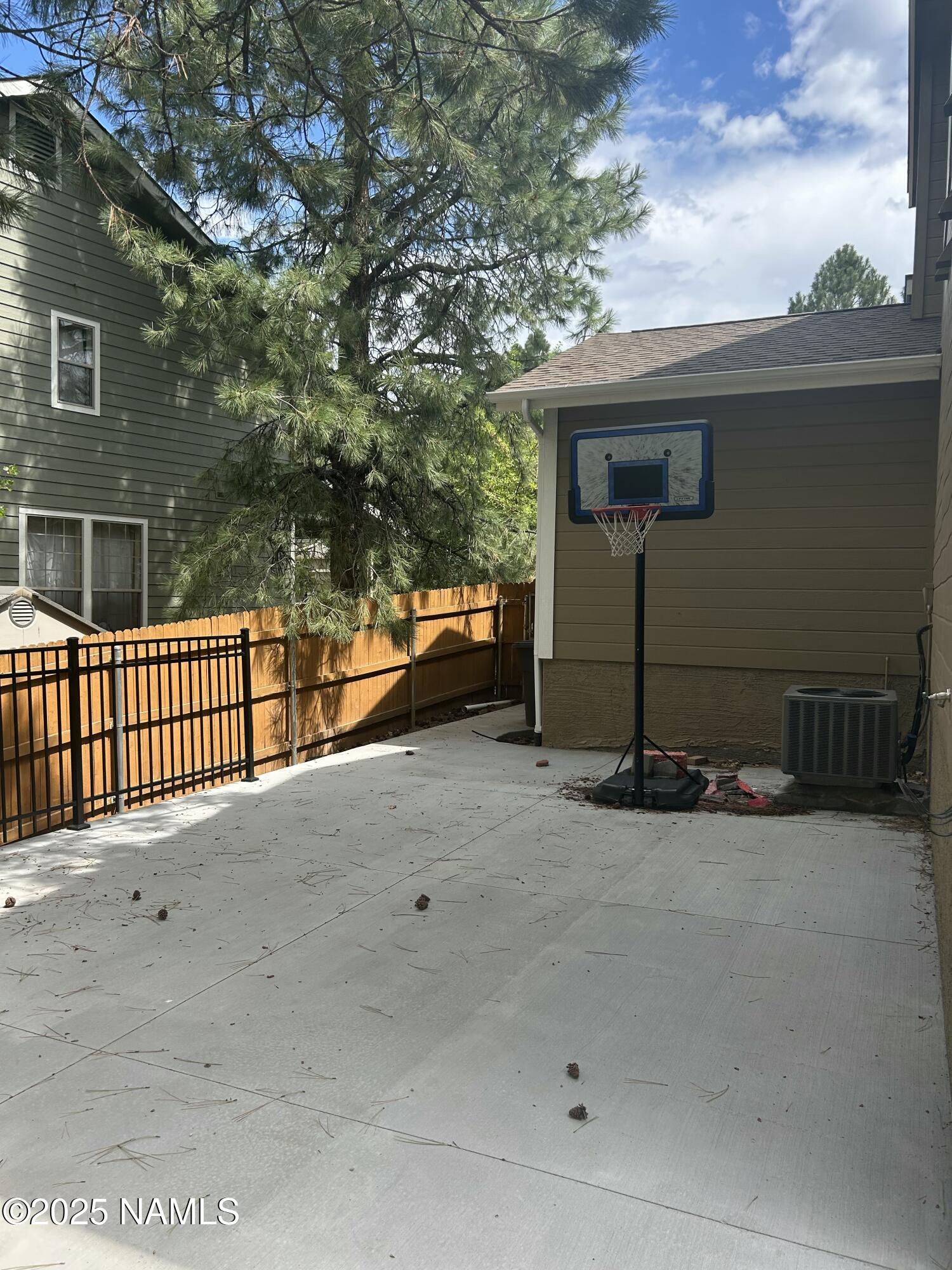 5053 South Topaz Road Flagstaff, AZ 86005 - Photo 25 of 25 a view of a house with a wooden fence
