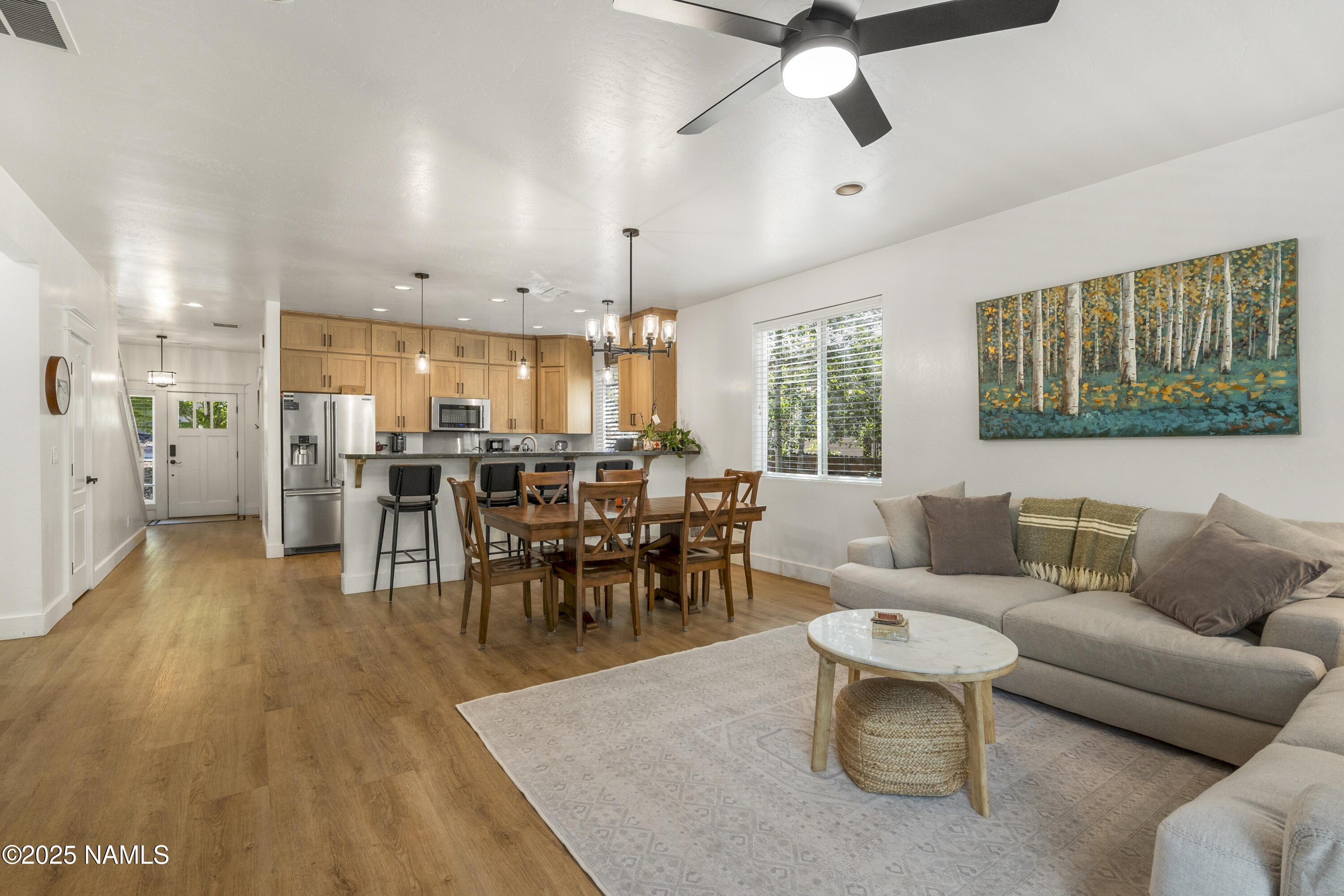 5053 South Topaz Road Flagstaff, AZ 86005 - Photo 5 of 25 a living room with furniture kitchen view and a dining table