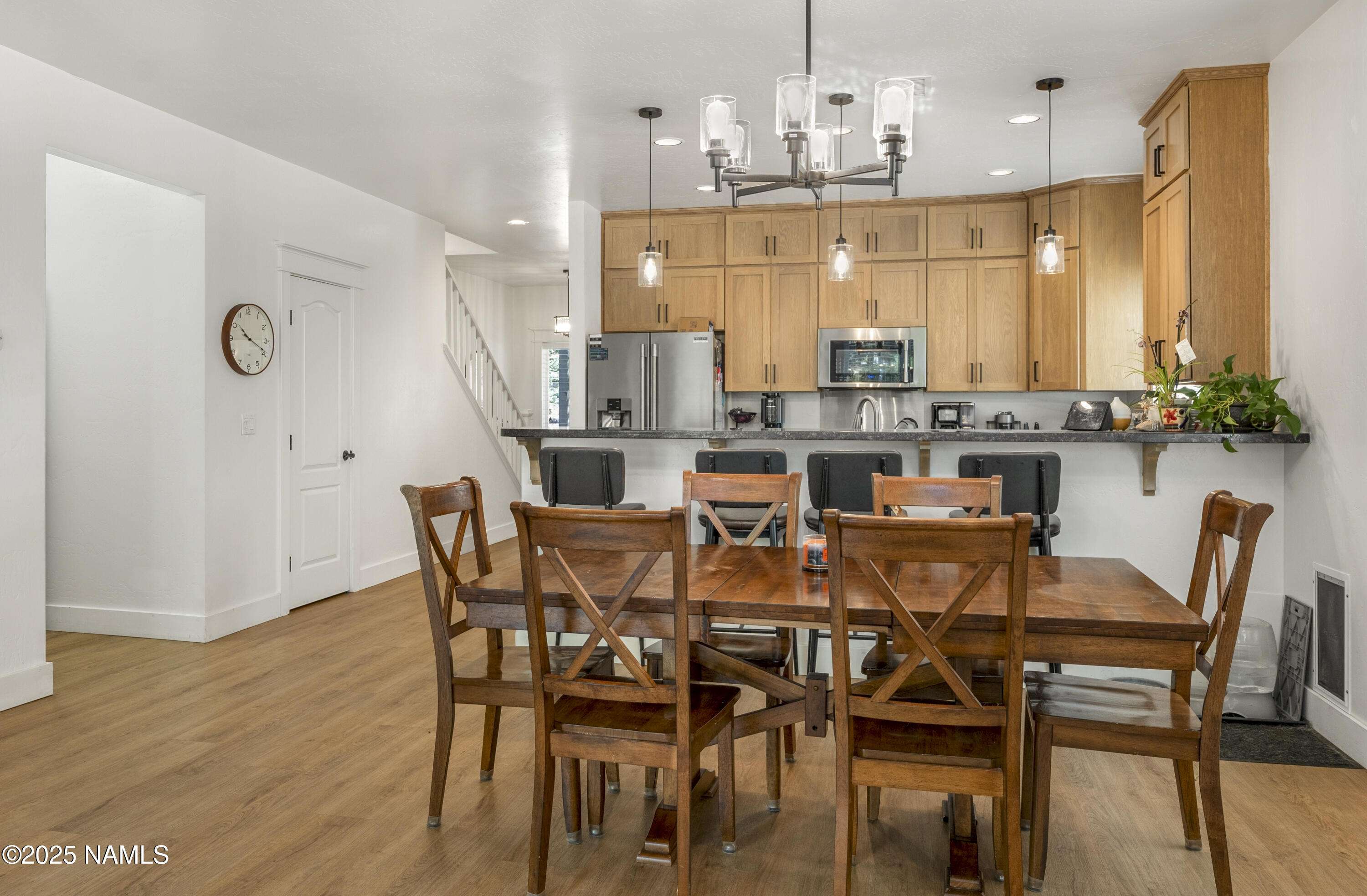 5053 South Topaz Road Flagstaff, AZ 86005 - Photo 7 of 25 a view of a dining room with furniture and wooden floor
