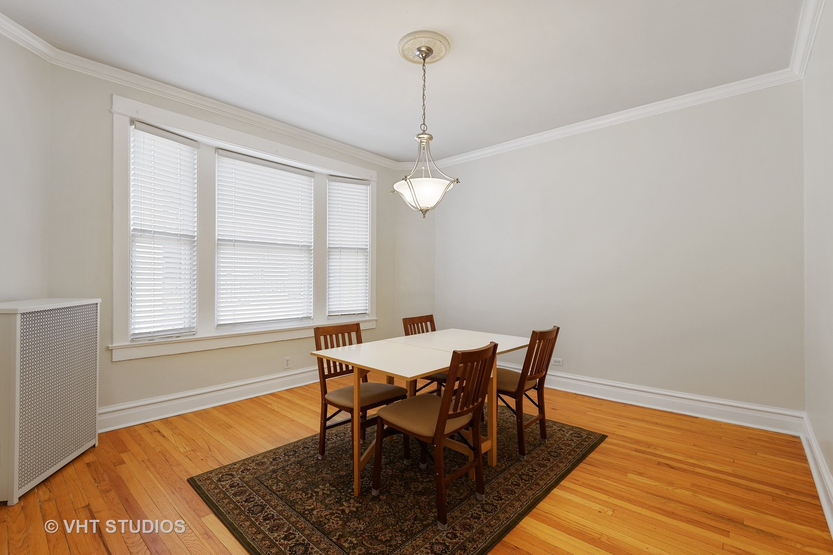 834 West Lakeside Place, Unit 2N Chicago, IL 60640 - Photo 6 of 13 a view of a dining room with furniture window and wooden floor