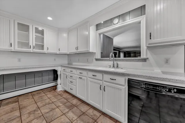 a kitchen with stainless steel appliances granite countertop a sink and a stove