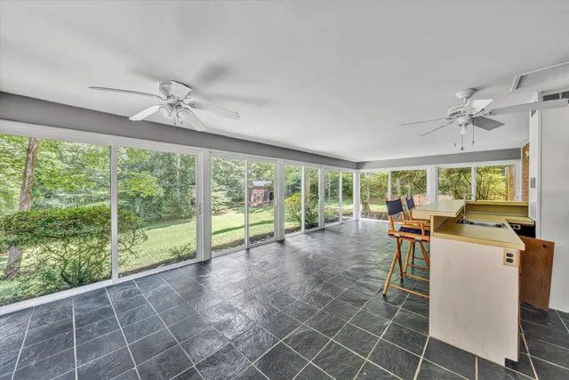 a view of a dining room with furniture window and outside view