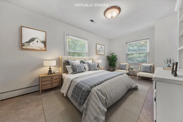 a bedroom with bed room and window