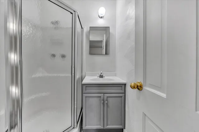a bathroom with a sink and mirror