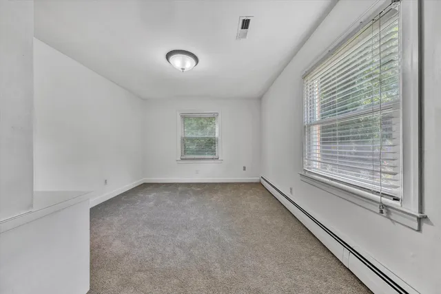 a view of a room that has a window in it