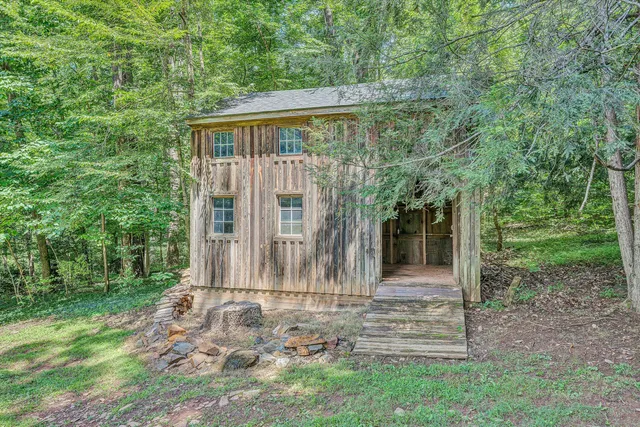 front view of a house with a tree