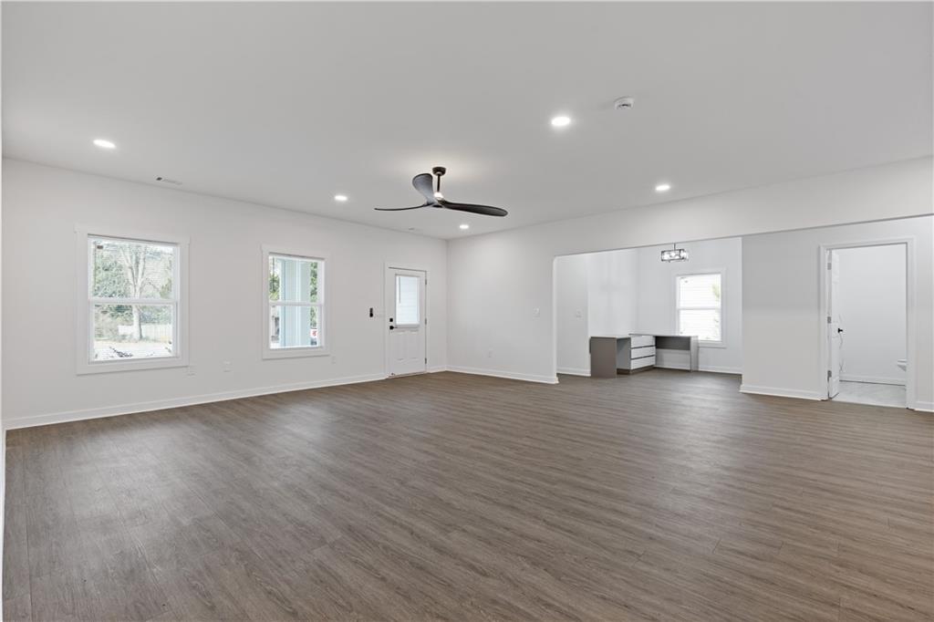 3272 Corktree Trail Lithonia, GA 30038 - Photo 9 of 22 a view of empty room with wooden floor and window