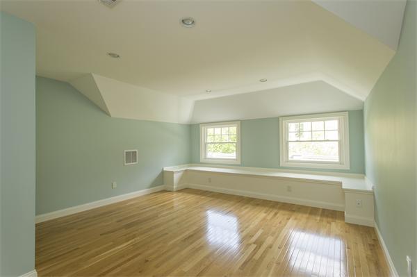 15 Circuit Road Brookline, MA 02467 - Photo 16 of 28 an empty room with wooden floor and windows