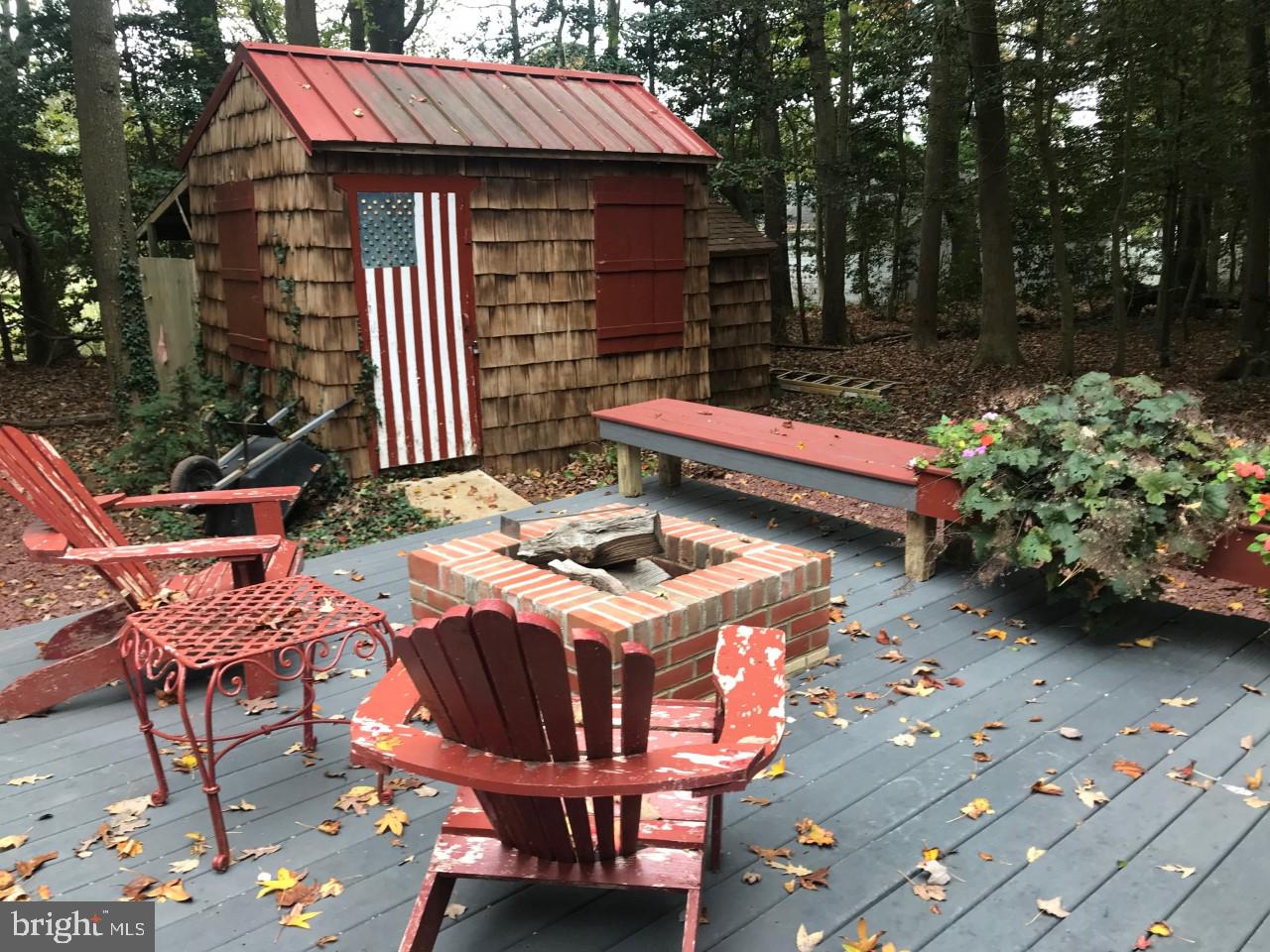 15376 Hudson Road Milton, DE 19968 - Photo 7 of 67 private back deck with fire pit