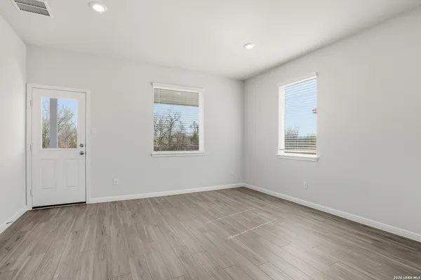 a view of room with window and hardwood floor