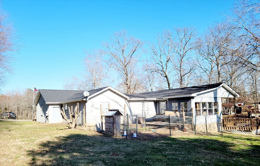493 Northridge Drive Decatur, TN 37322 - Photo 9 of 43 a front view of a house with a yard