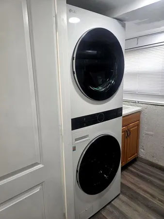 a view of a hallway with washer and dryer