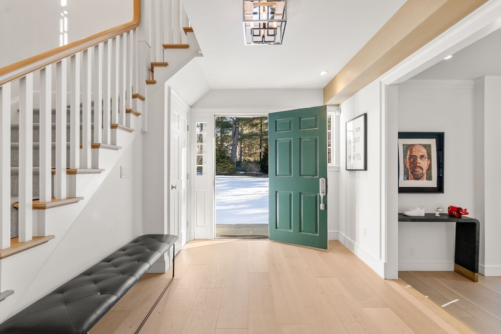 389 Grove Street Needham, MA 02492 - Photo 2 of 40 a view of hallway with stairs and wooden floor