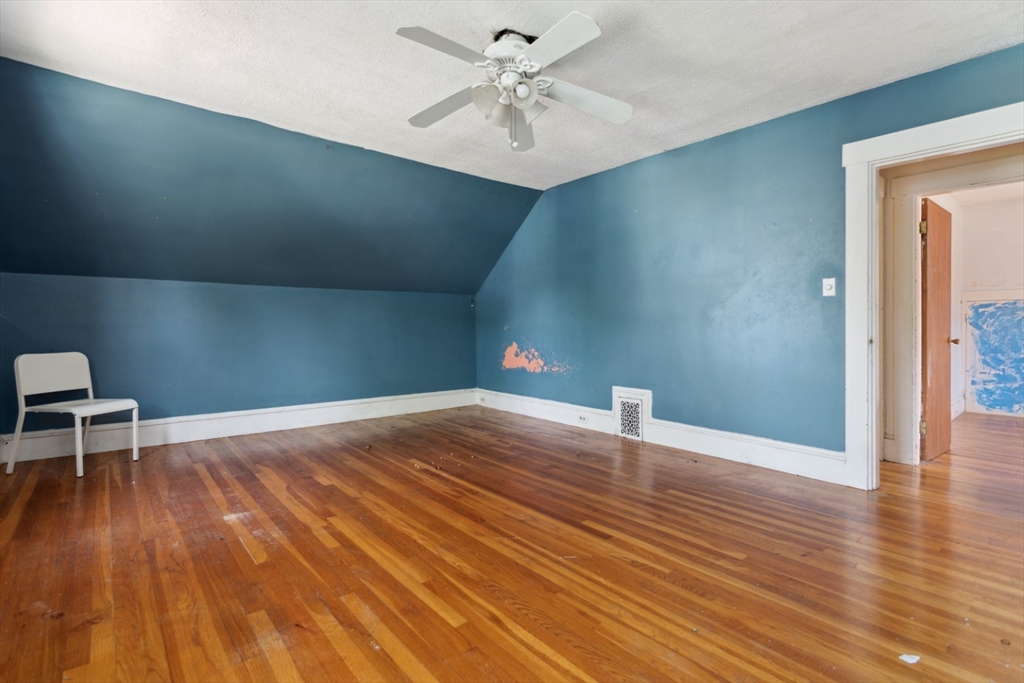 40 Village Street Reading, MA 01867 - Photo 19 of 36 a view of empty room with wooden floor
