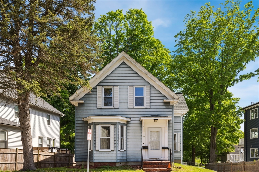 40 Village Street Reading, MA 01867 - Photo 2 of 36 a view of a house with a yard