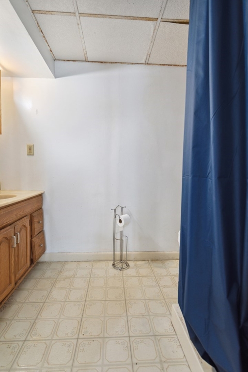 40 Village Street Reading, MA 01867 - Photo 27 of 36 a room with window and a table