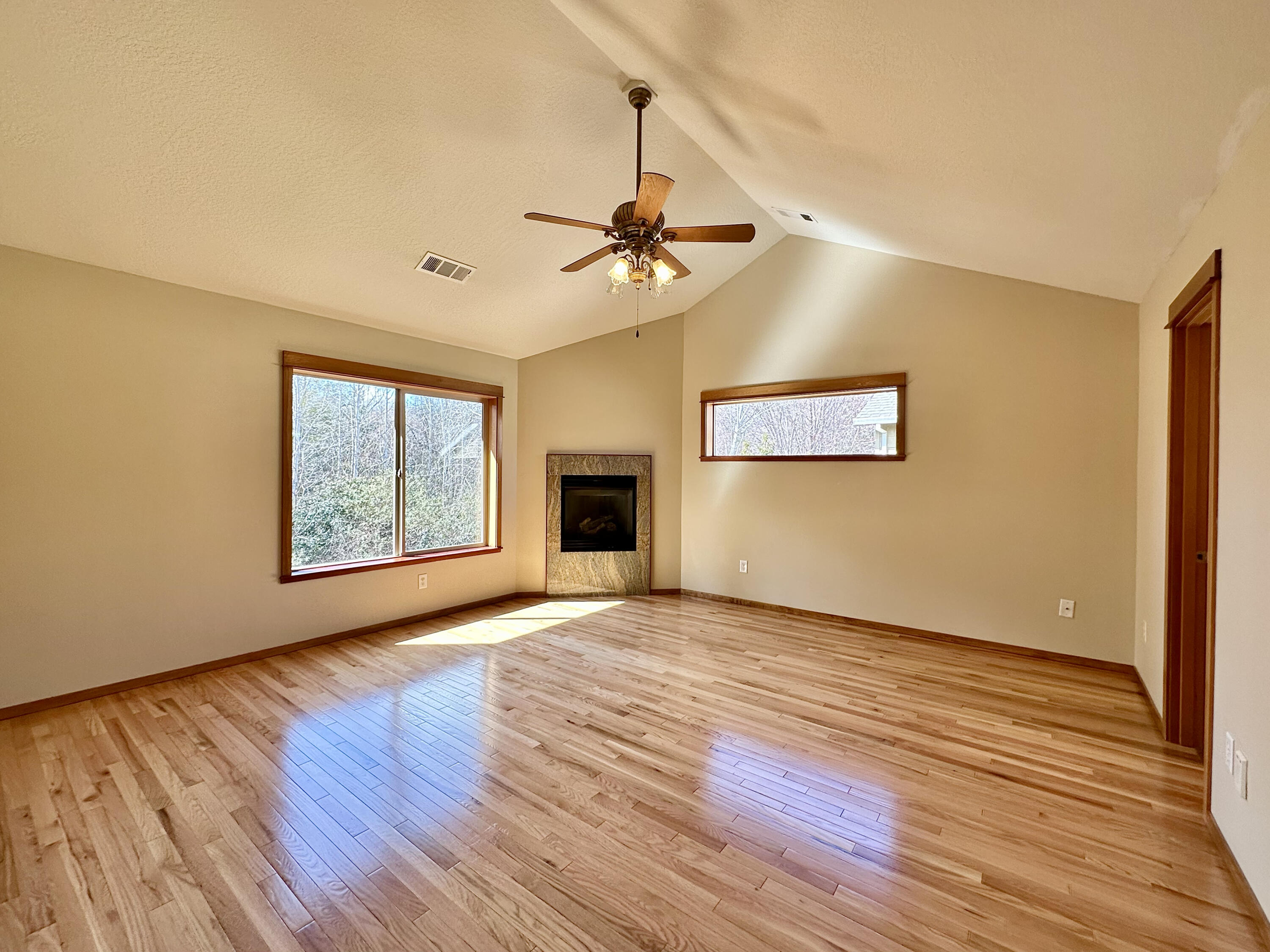 133 Max Loop Talent, OR 97540 - Photo 25 of 55 a view of an empty room with a window and wooden floor