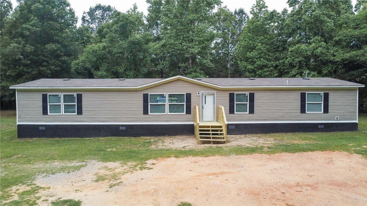 751 Ellis Road Shorter, AL 36075 - Photo 2 of 20 This charming home offers comfortable living with a well-maintained exterior and inviting front entry.