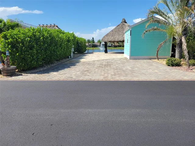 a view of a house with a yard and garage