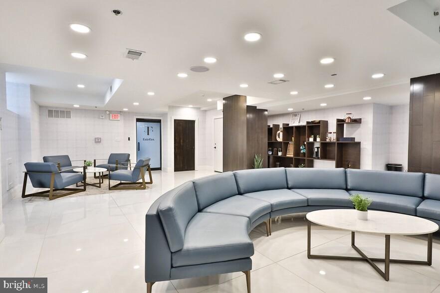 4247 Locust Street, Unit 0B601 Philadelphia, PA 19104 - Photo 15 of 38 a living room with furniture and kitchen view