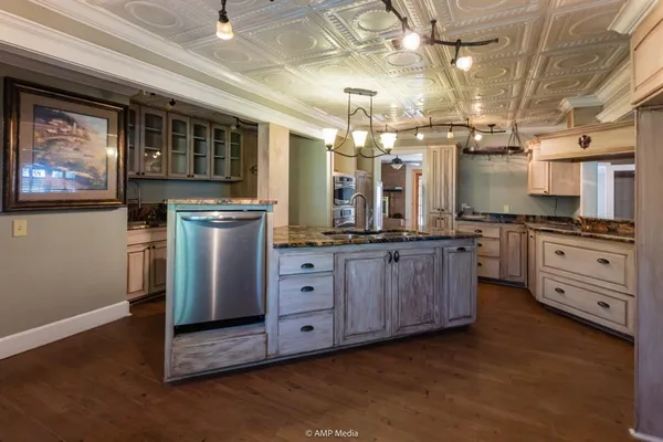 a kitchen with sink refrigerator and window