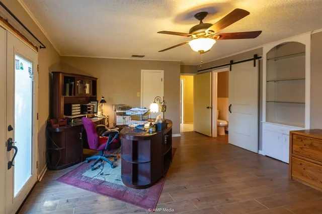 a view of a wooden fence next to a road