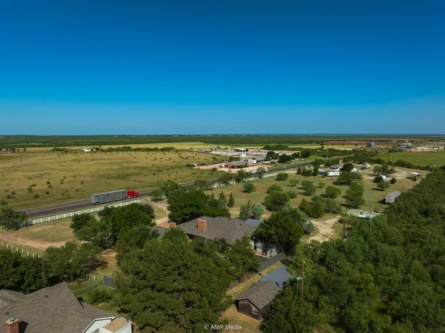 an aerial view of residential building and ocean