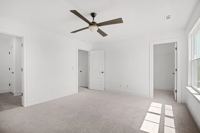 a bathroom with double vanity sink a mirror and shower