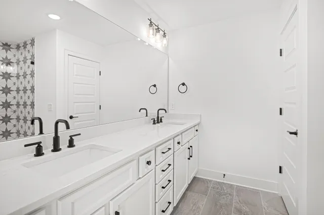 a bathroom with a bathtub and shower