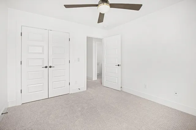 a view of entryway with wooden floor and stairs