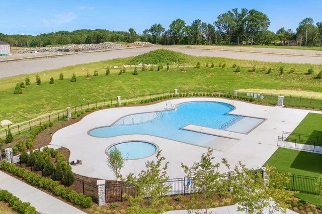 a view of swimming pool with a yard and outdoor seating