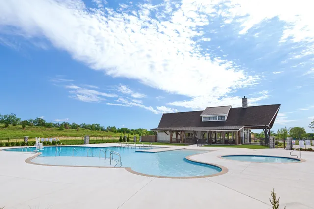 an aerial view of a house with a big yard