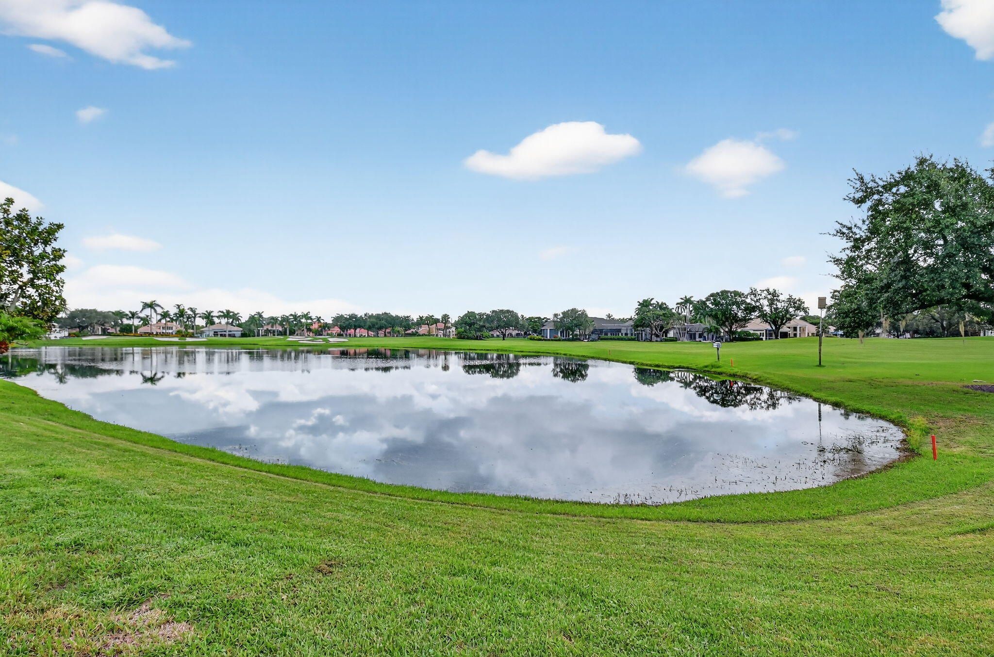 2563 Northwest 63rd Street Boca Raton, FL 33496 - Photo 52 of 65 a view of a lake with a big yard