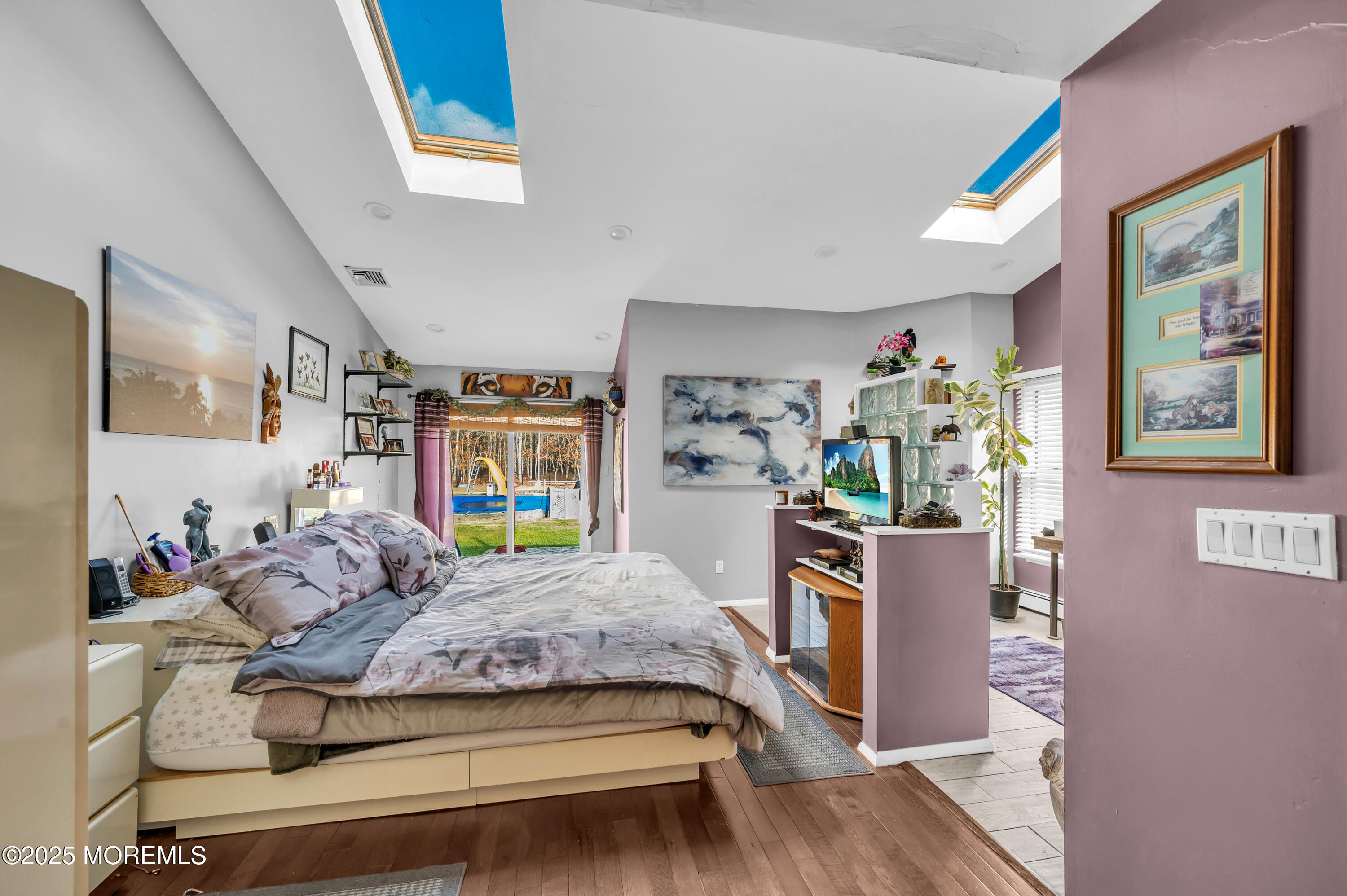 98 Bowman Road Jackson, NJ 08527 - Photo 44 of 61 a bedroom with a bed and wooden floor