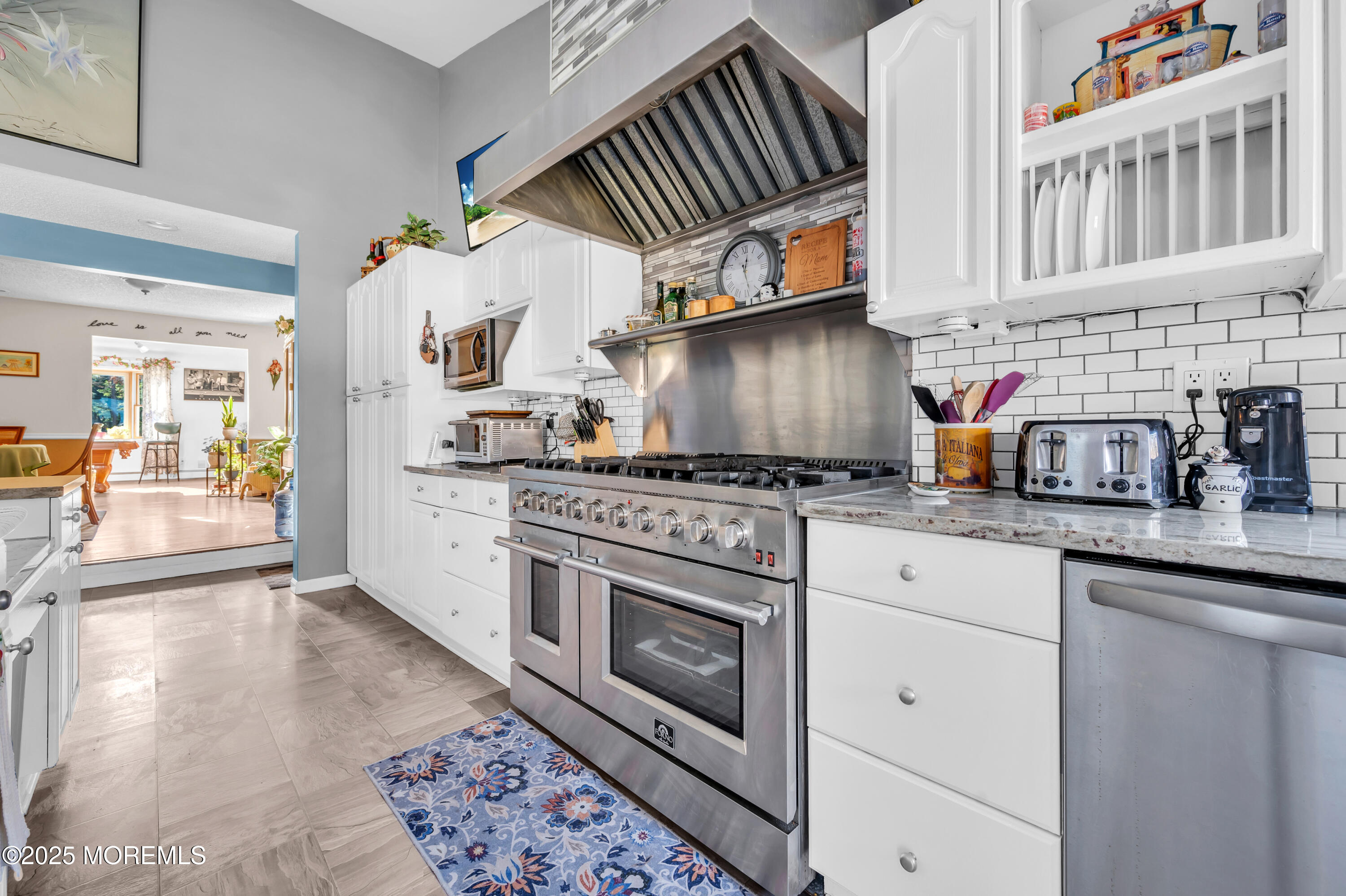 98 Bowman Road Jackson, NJ 08527 - Photo 7 of 61 a kitchen with stainless steel appliances granite countertop a stove and a sink