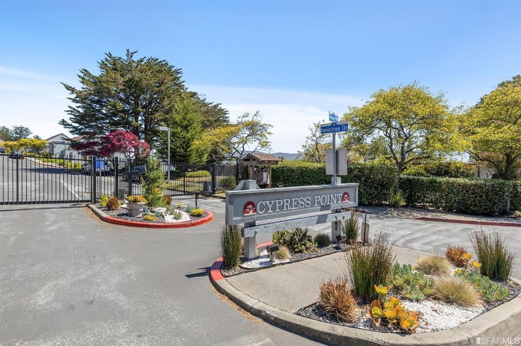 a view of a backyard with sitting area