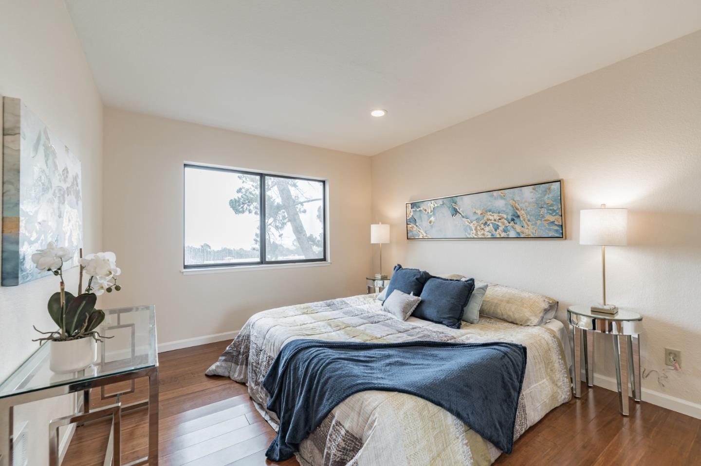 348 Innisfree Drive, Unit 60 Daly City, CA 94015 - Photo 11 of 21 a bedroom with a bed and wooden floor