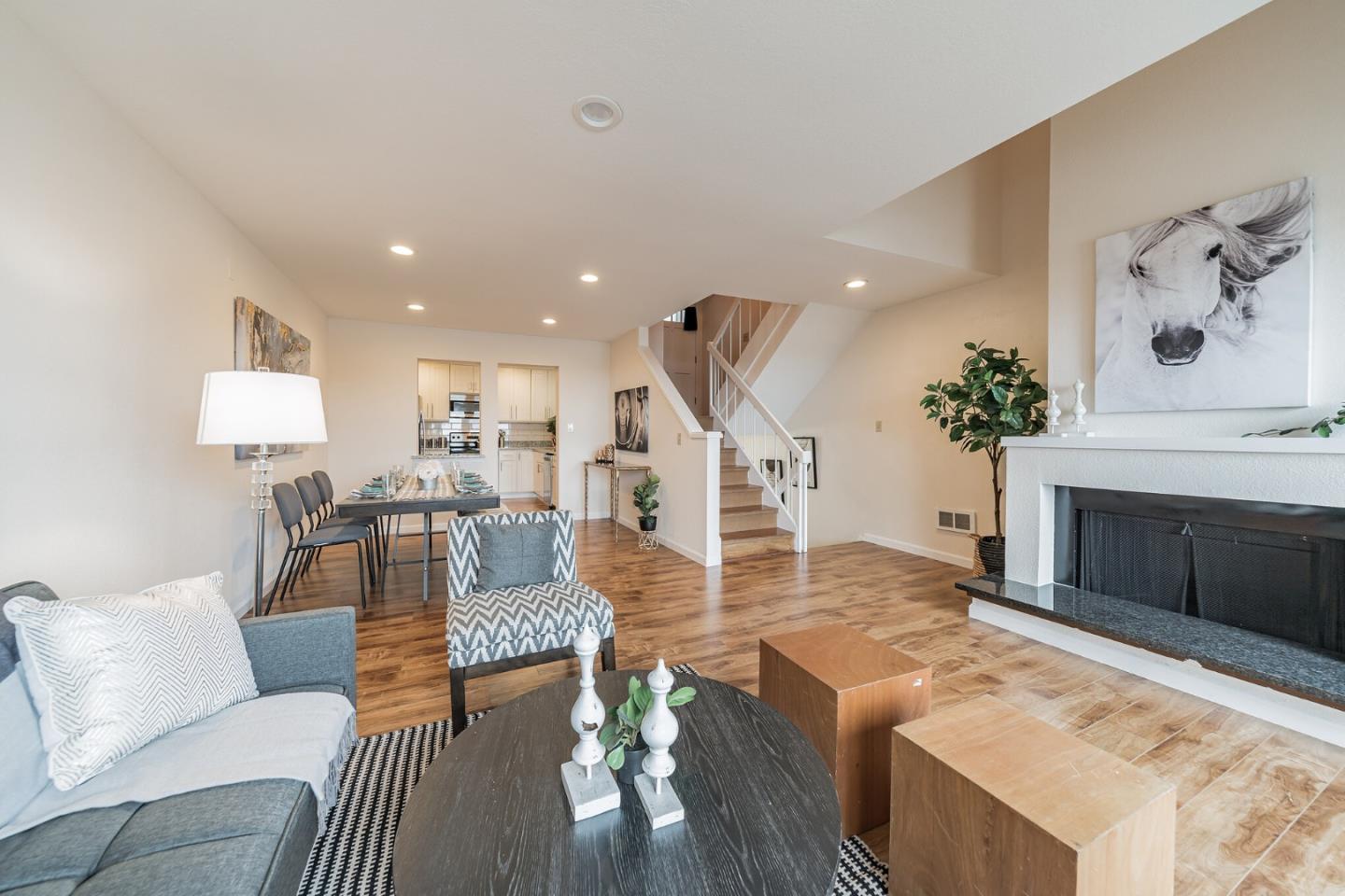 348 Innisfree Drive, Unit 60 Daly City, CA 94015 - Photo 3 of 21 a living room with furniture and a fireplace