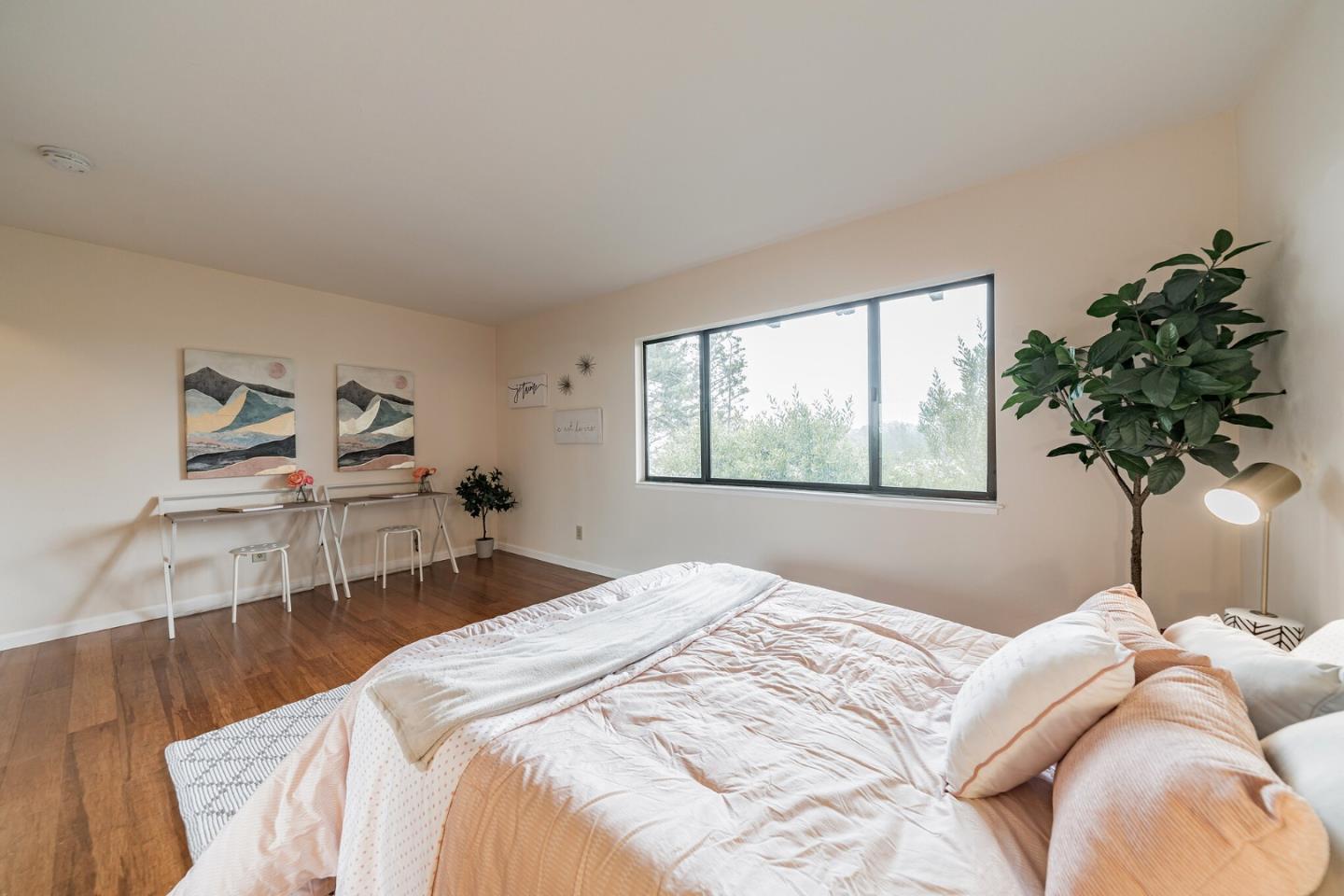 348 Innisfree Drive, Unit 60 Daly City, CA 94015 - Photo 9 of 21 a bedroom with a bed and a potted plant