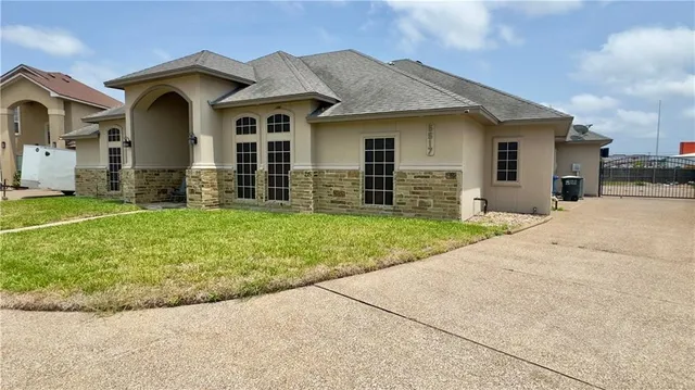 front view of a house with a yard