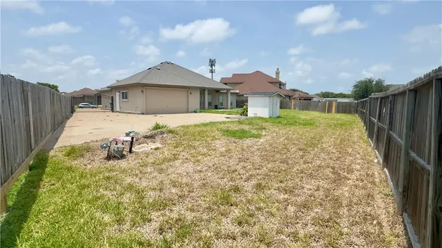 a front view of a house with yard