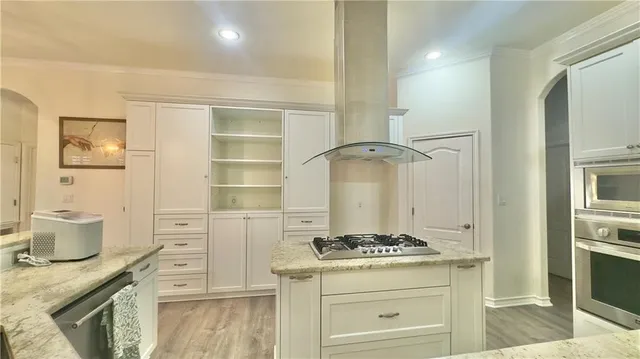 a kitchen with a stove and a cabinets