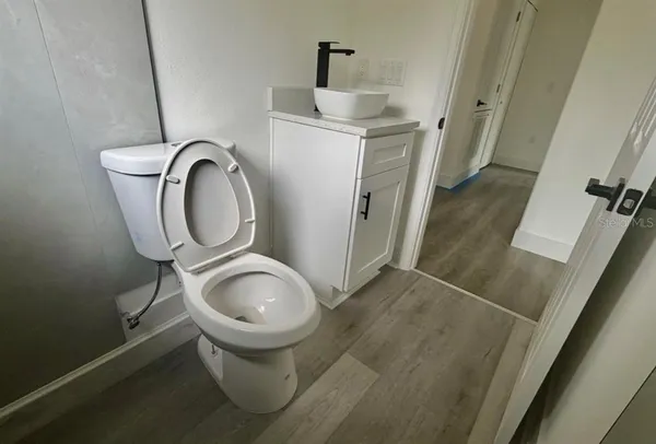 a bathroom with a toilet and a sink